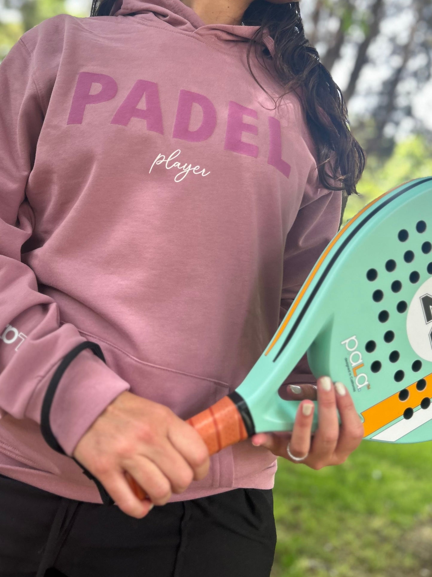 woman wearing a P.ala Padel Player Sweater
