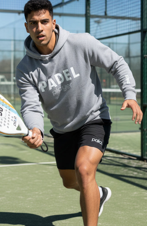 man playing padel with grey hoodie from pala padel usa with monte carlo padel racket