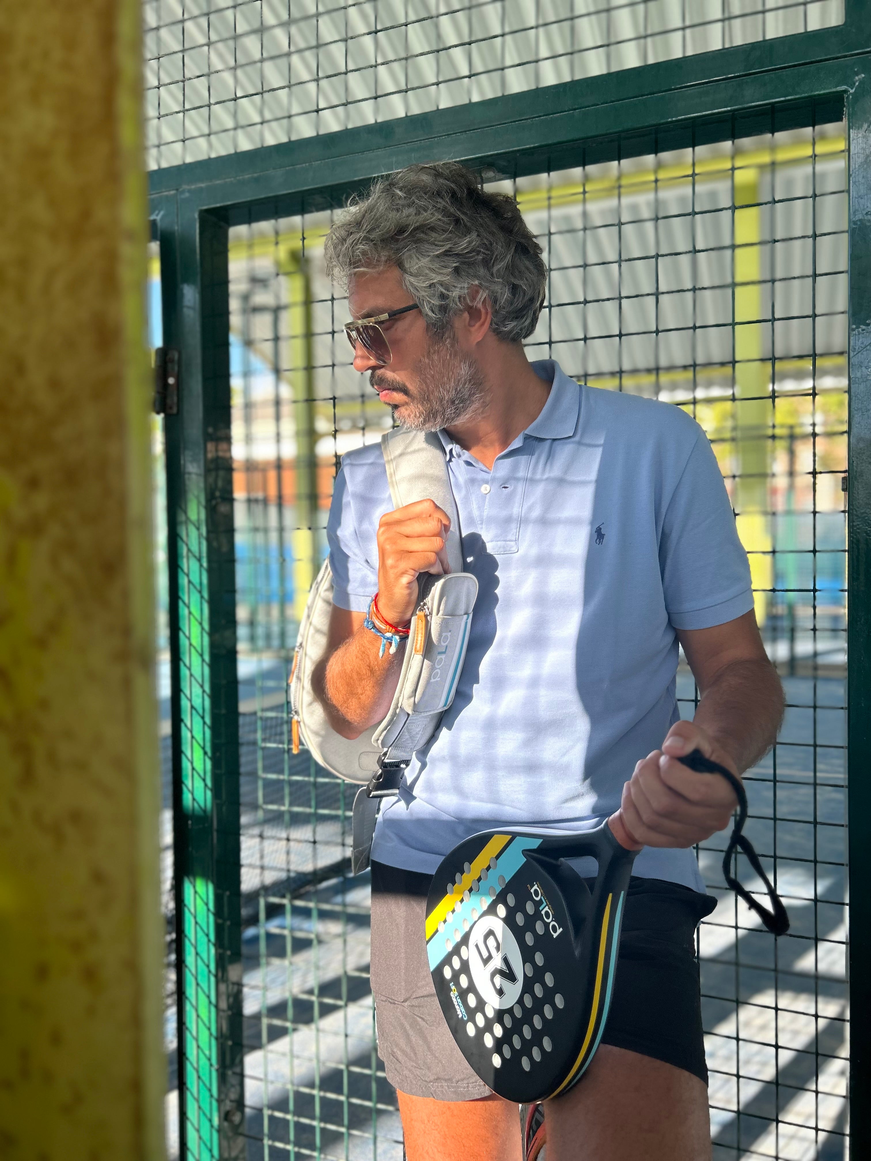 PALA PADEL RACKET MONACO BLACK IN A PADEL COURT FOR MEN