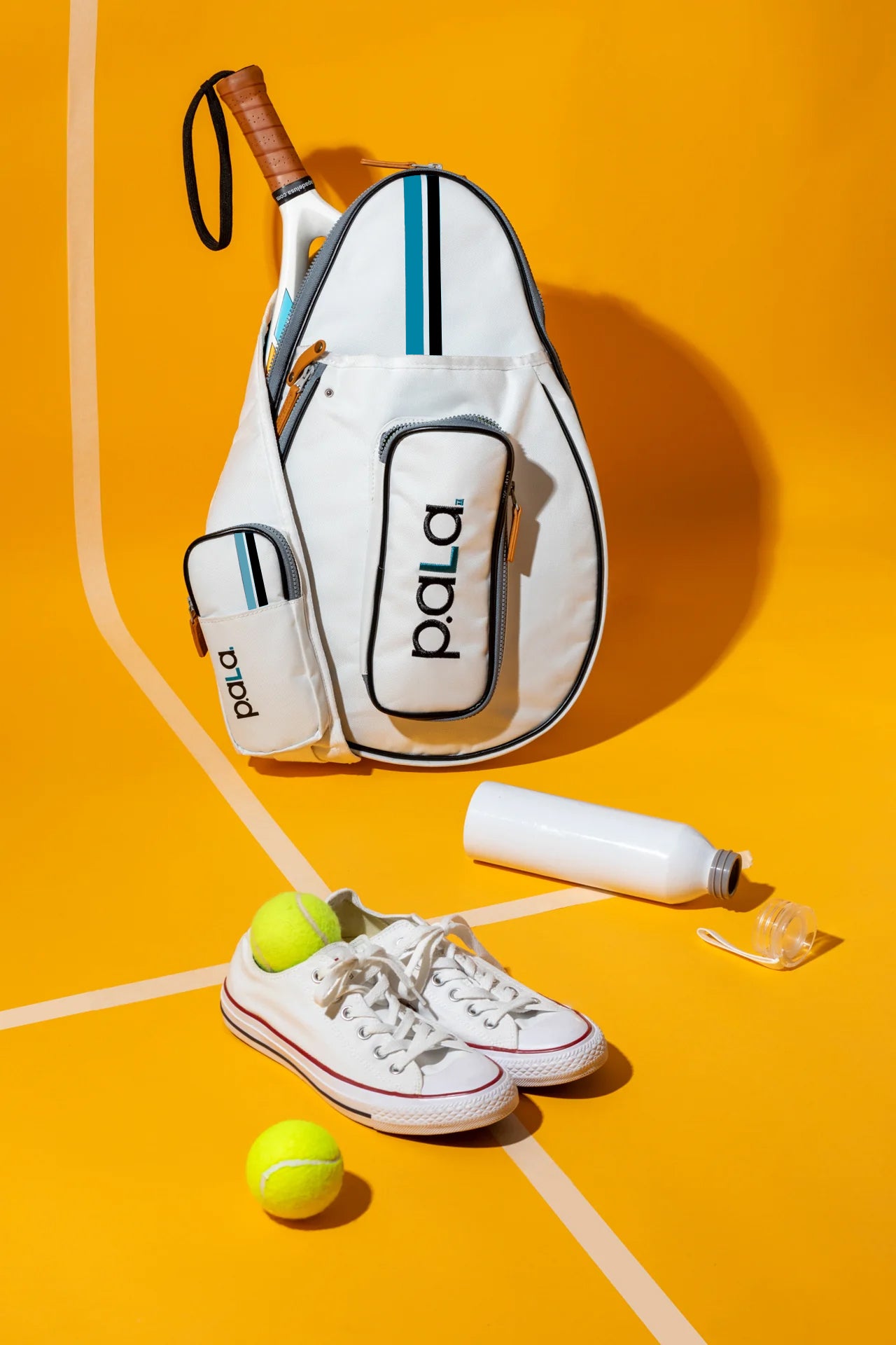 sling padel bag white with many compartments for phone balls padel racket and many more accesories