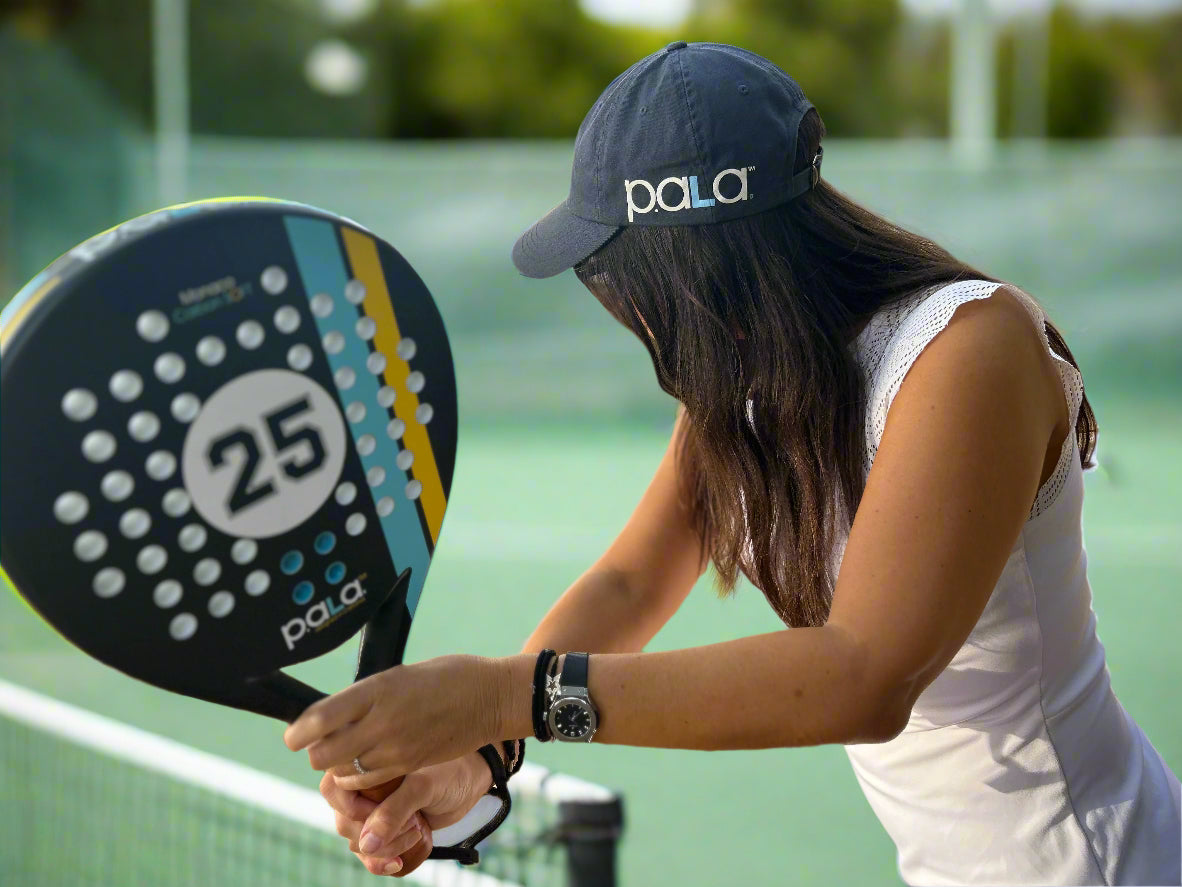 woman playing padel with a Monaco Carbon soft padel racket by p.ala