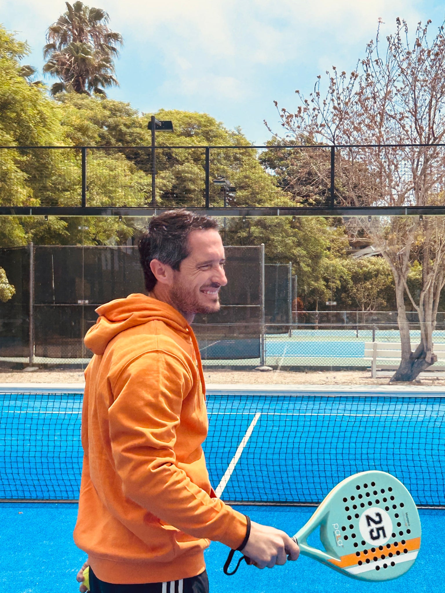 pala padel aqua in a padel court with men playing padel