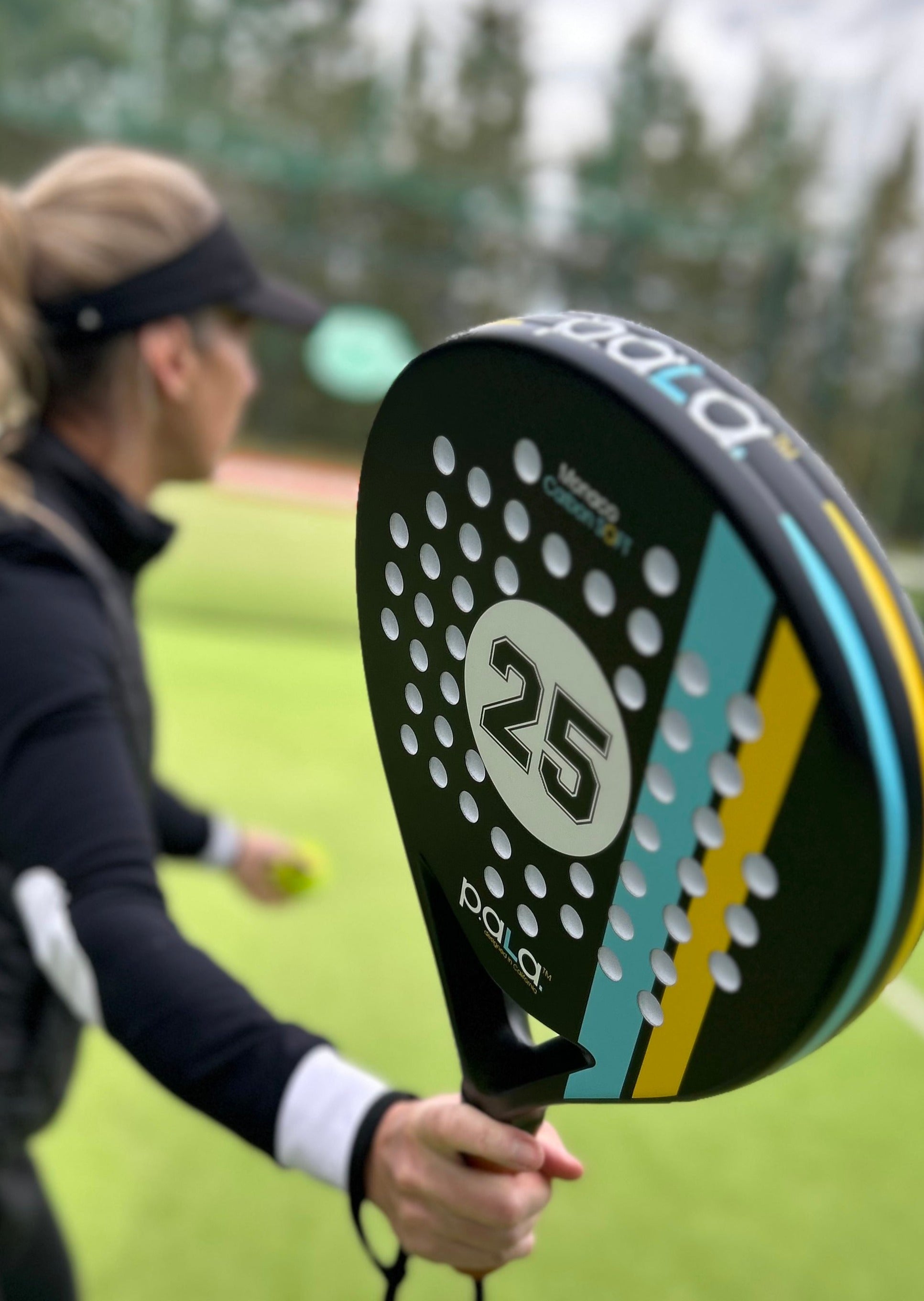 Padel racket with ergonomic grip and balanced weight distribution