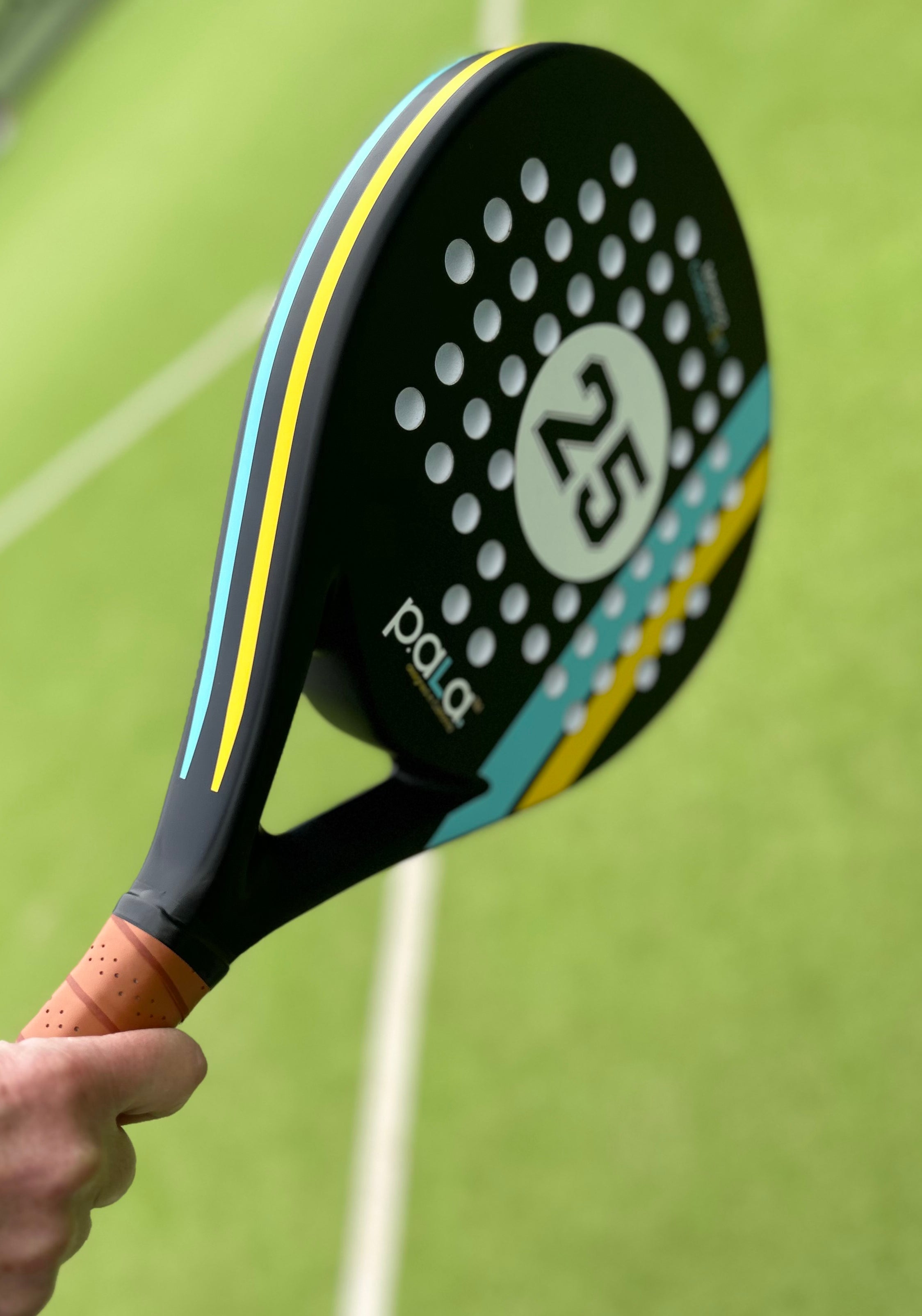 PALA PADEL RACKET in a padel court with green grass