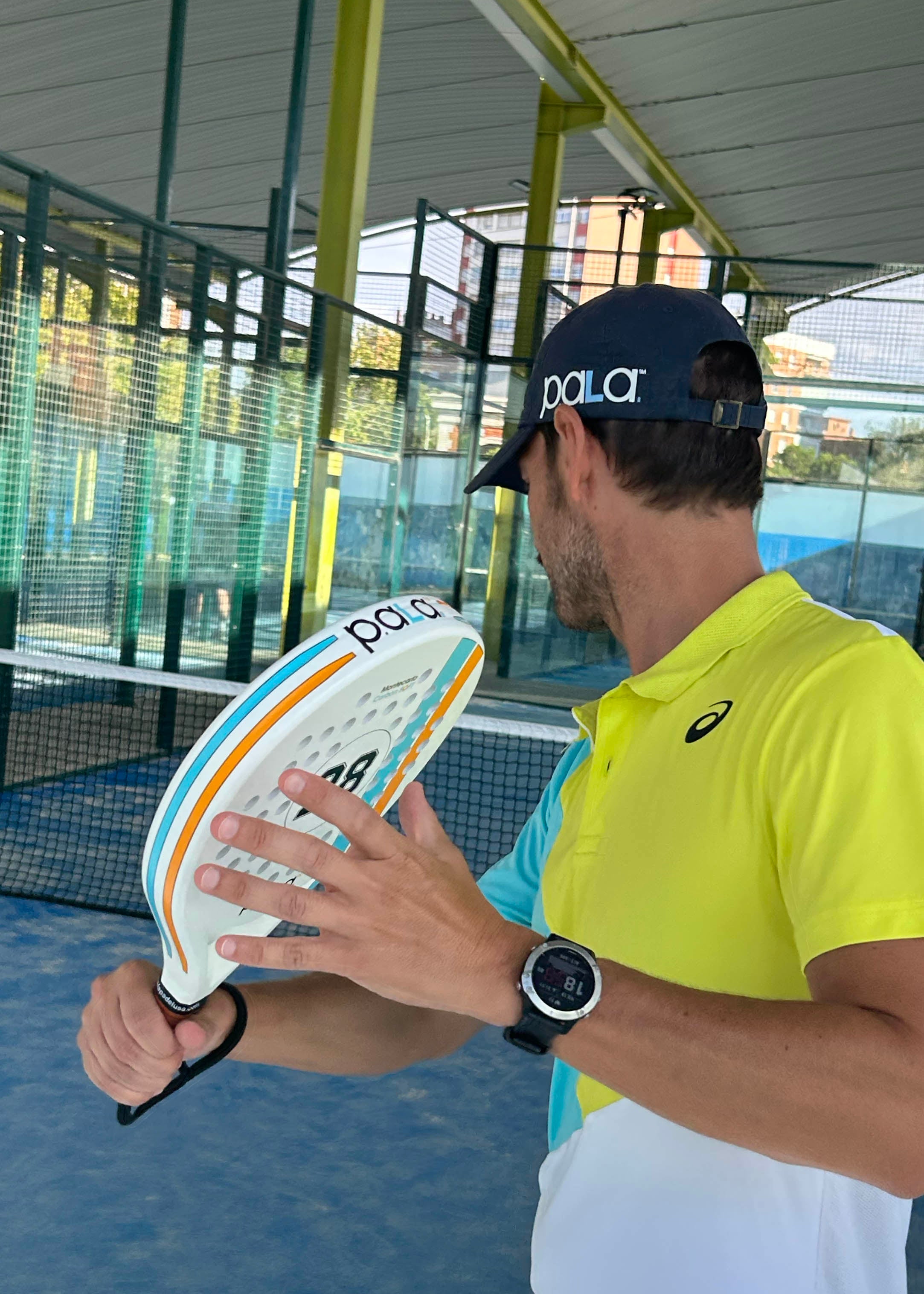 P.ala Montecarlo Padel Racket on the court with its distinctive orange and blue accents
