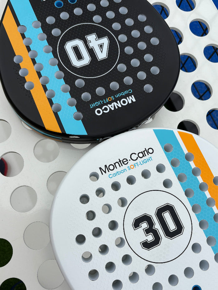 Two paddle sports padel rakcets with visible brand names on a textured background