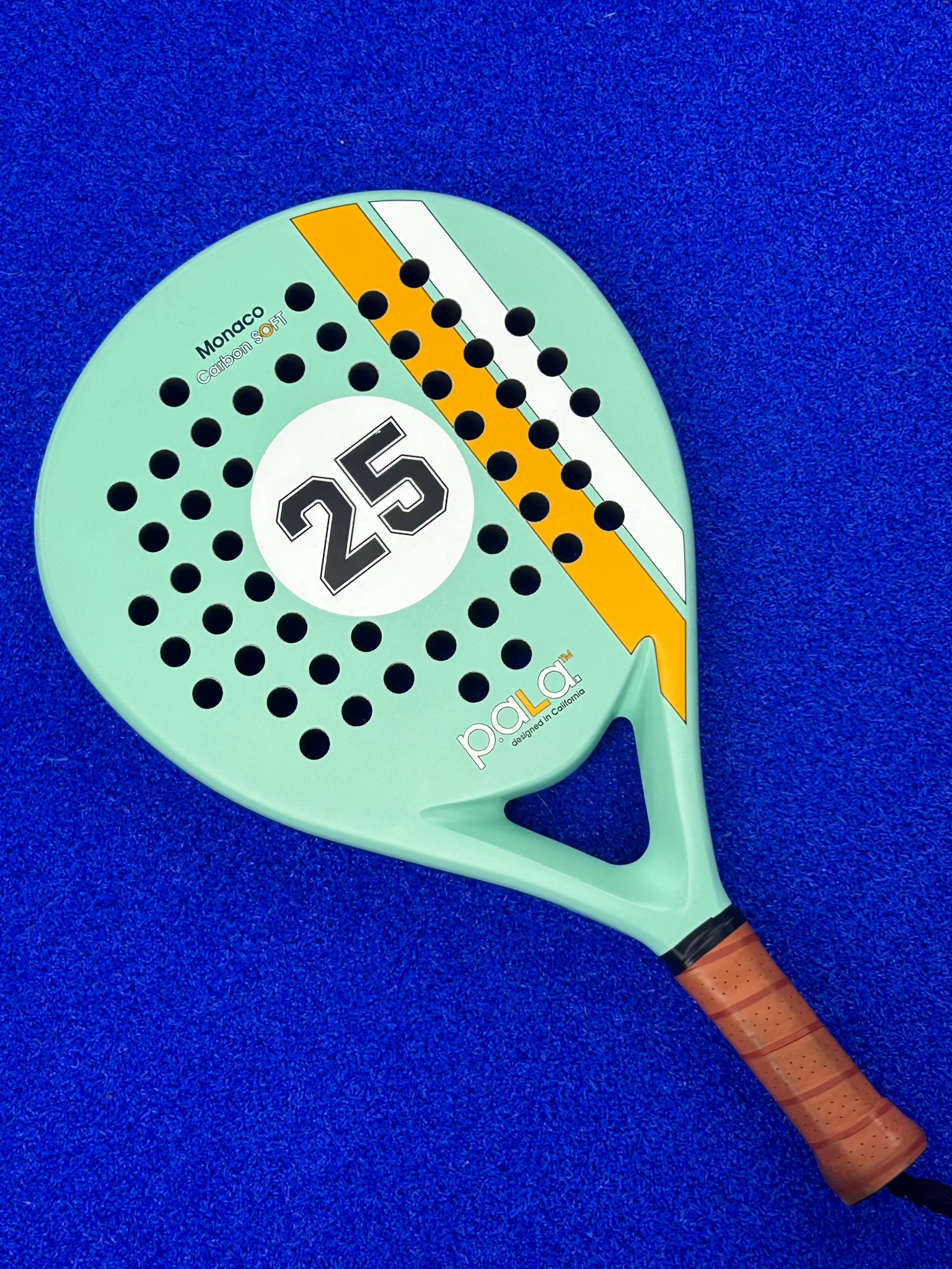 Close-up of the PALA Aqua 25 Padel Racket showcasing its sleek aqua color and durable frame